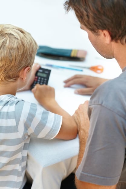 A close-up shot of a parent's hands holding a child's hands, with a calculator and financial documents subtly blurred in the background. The image emphasizes the financial support the Child Tax Credit provides.