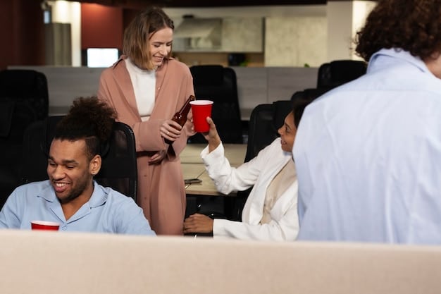 A group of professionals networking at a conference, engaging in conversation and exchanging business cards, highlighting the career benefits of a master's degree.