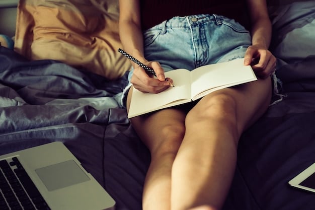 A close-up shot of a student's hand writing a college application essay with a pen, surrounded by books and notes. The atmosphere is studious and focused.