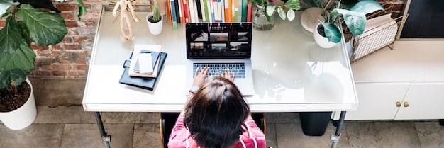 A person working on a laptop at a desk with good organization. The scene should convey productivity and a focused mindset, with elements like a planner, notebooks, and necessary study materials within easy reach. The environment is well-lit and conducive to learning..