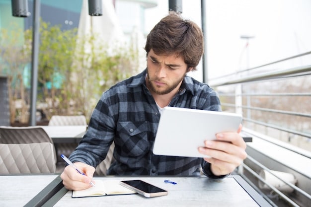 A student reviewing a list of potential scholarships on a tablet, highlighting the relevant ones, with a focused and determined expression.