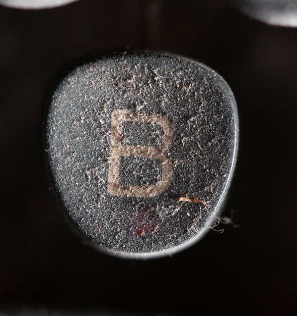 A gavel hitting a block with a Bitcoin symbol engraved on it, illustrating legal action and regulation within the cryptocurrency space.