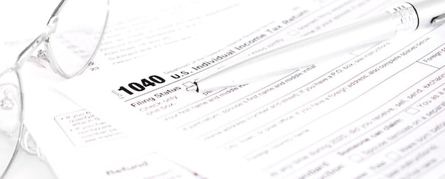 A close-up of IRS Form 8812 filled out with neat handwriting, highlighting key sections related to claiming the Child Tax Credit.