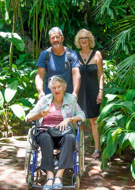 A split image showing three distinct groups: retirees relaxing in a park, a disabled individual using assistive technology, and a single parent with children, each group representing different Social Security beneficiaries and their unique financial needs.
