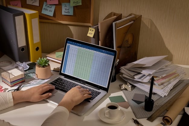 A person working on a laptop with tax forms displayed on the screen, highlighting key sections with a pen. The background is a well-organized office setting.