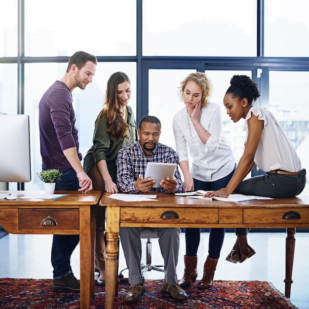A diverse group of young professionals collaborating on a project in a modern office setting. They are discussing design ideas on a whiteboard and using laptops to research different solutions. The atmosphere is energetic and collaborative, reflecting the skills gained from New Education Initiatives Announced: Focus on STEM Skills and Workforce Development.