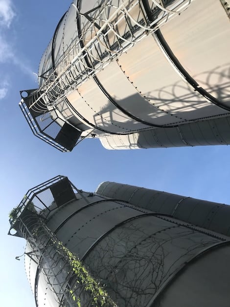 A detailed close-up of a carbon capture and storage facility, showcasing the advanced technology used to trap and store carbon dioxide emissions. Pipes, filters, and storage tanks are visible, illustrating the process of reducing carbon pollution. This image highlights the technical solutions encouraged by the Environmental Protection Agency Announces New Regulations on Carbon Emissions.