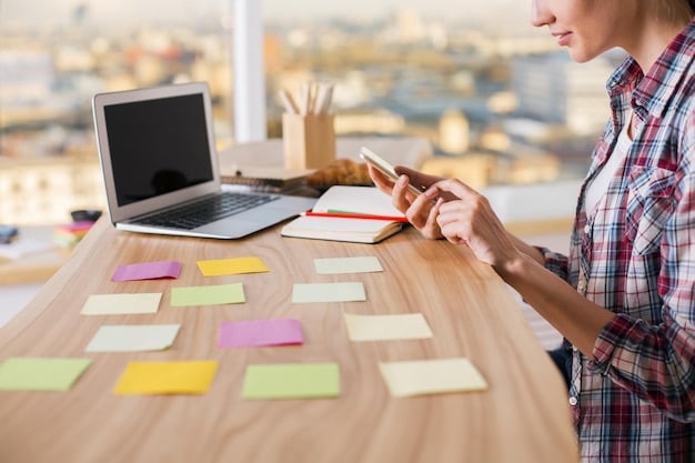 A person working on a laptop, with sticky notes displaying various tasks and deadlines around the screen, illustrating time management and organizational skills. This image captures the essence of self-management and efficiency in the workplace and how important it is to the essence of 5 Unexpected Skills Employers Now Value More Than a College Degree.