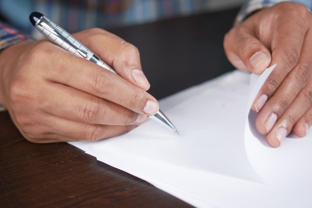 A close-up of a hand signing a document labeled 