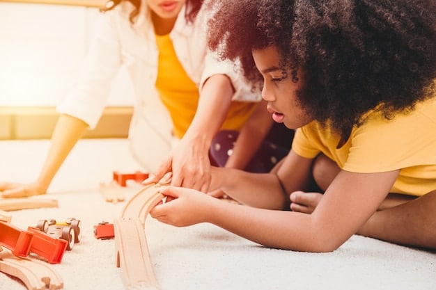 An image showing a diverse group of young children collaborating on a construction project with building blocks. The children are smiling and engaged, with a teacher observing and assisting. The image demonstrates the collaborative and skill-building aspects of early childhood education.