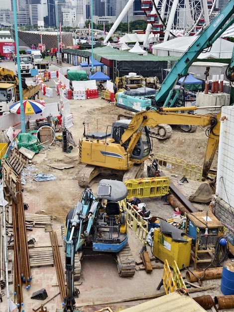 An image depicting a construction site with idle equipment, representing the halt in infrastructure projects due to a government shutdown. The image should convey a sense of economic slowdown and disruption of services.