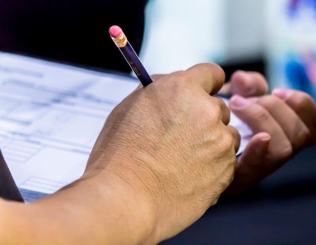 A close-up of a hand filling out a Social Security disability application form with a pen, highlighting the detailed nature of the application process.
