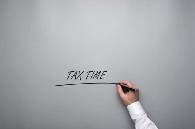 A close-up of a hand pointing at a line on a tax form indicating a specific tax credit. The image emphasizes attention to detail and the importance of identifying all potential credits.