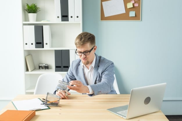 A person sitting at a desk, reviewing financial documents and using a calculator. The scene suggests careful management of resources and income, essential for understanding SSI eligibility requirements for Understanding Supplemental Security Income (SSI): Eligibility and Benefit Amounts in 2025.