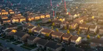 Suburban housing market under financial chart overlay, symbolizing Fed rate impact